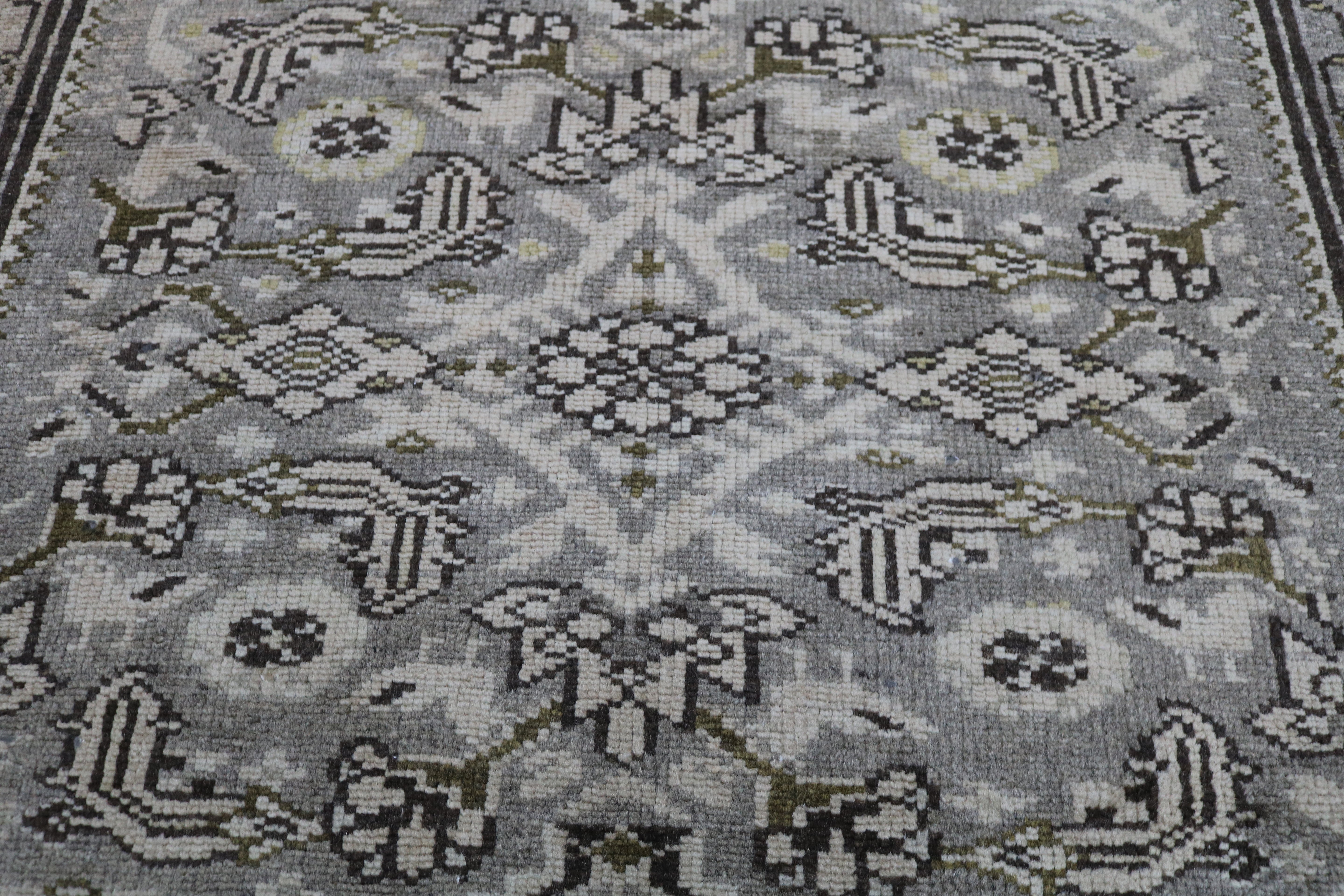 Close-up of hand-knotted wool texture on antique Persian Malayer runner

