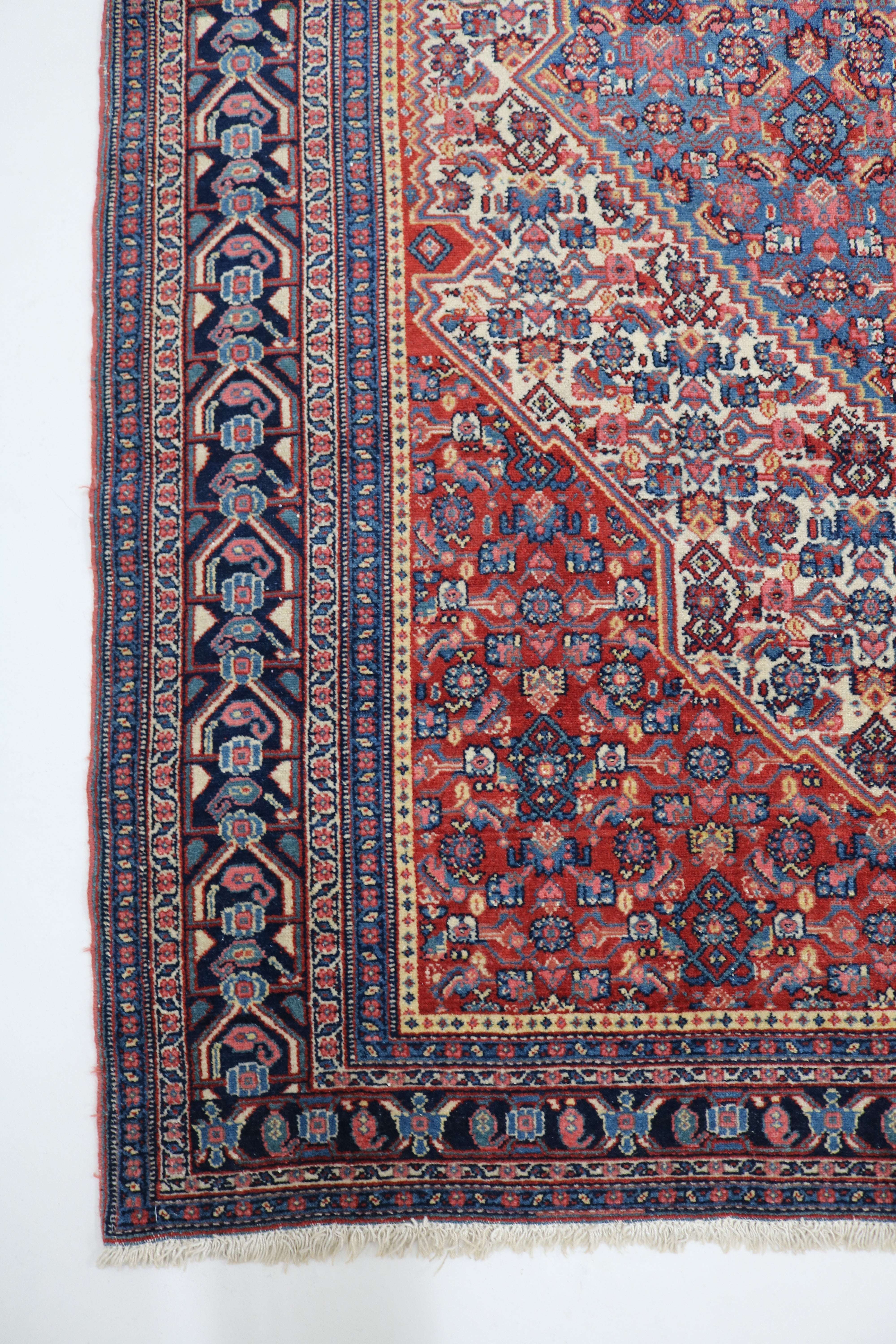 Long view of antique Persian Senneh rug showing fine proportions and delicate drawing, 196 × 140 cm
