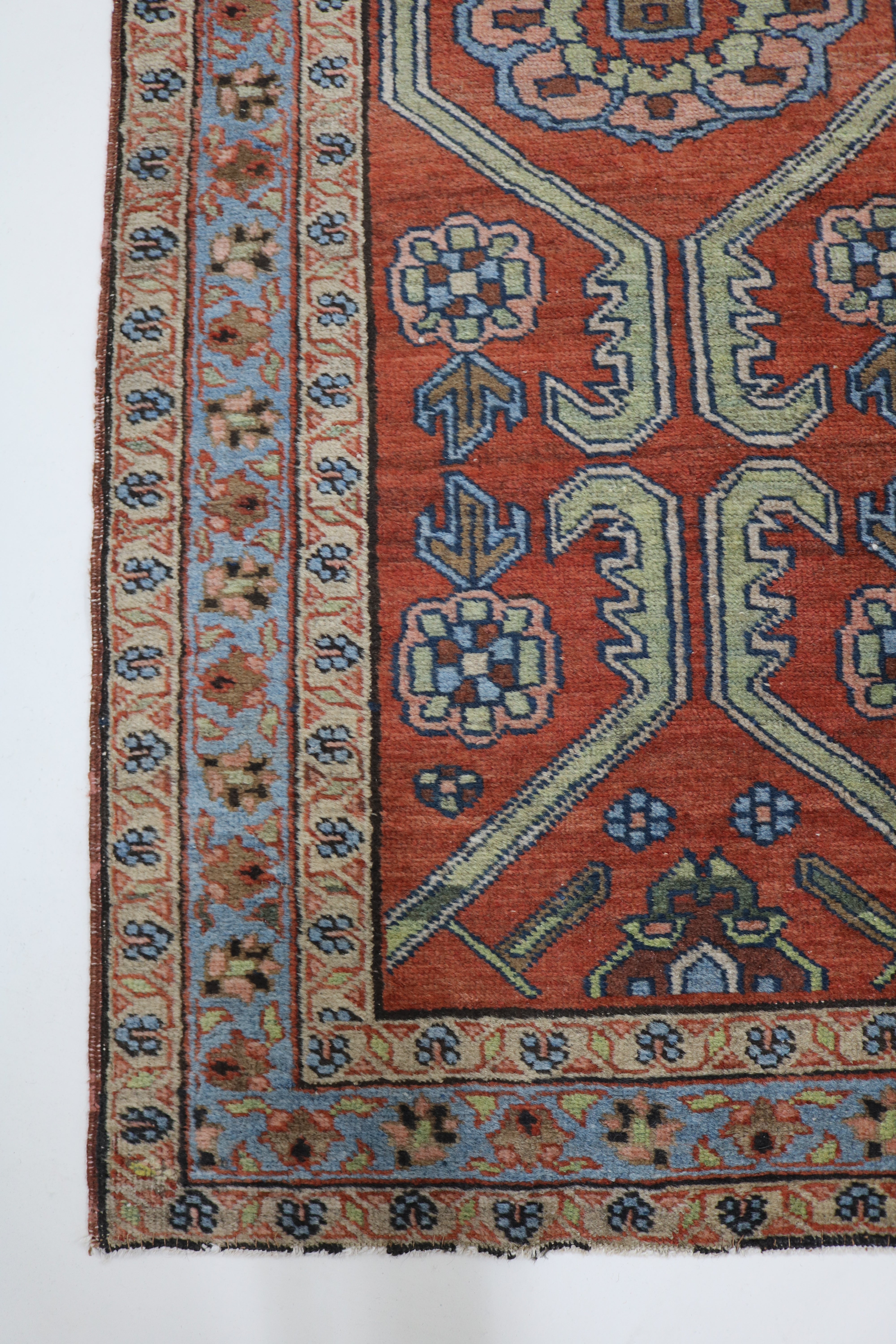 Long view of antique Persian Heriz rug showing narrow format and bold geometric design, 190 × 88 cm
