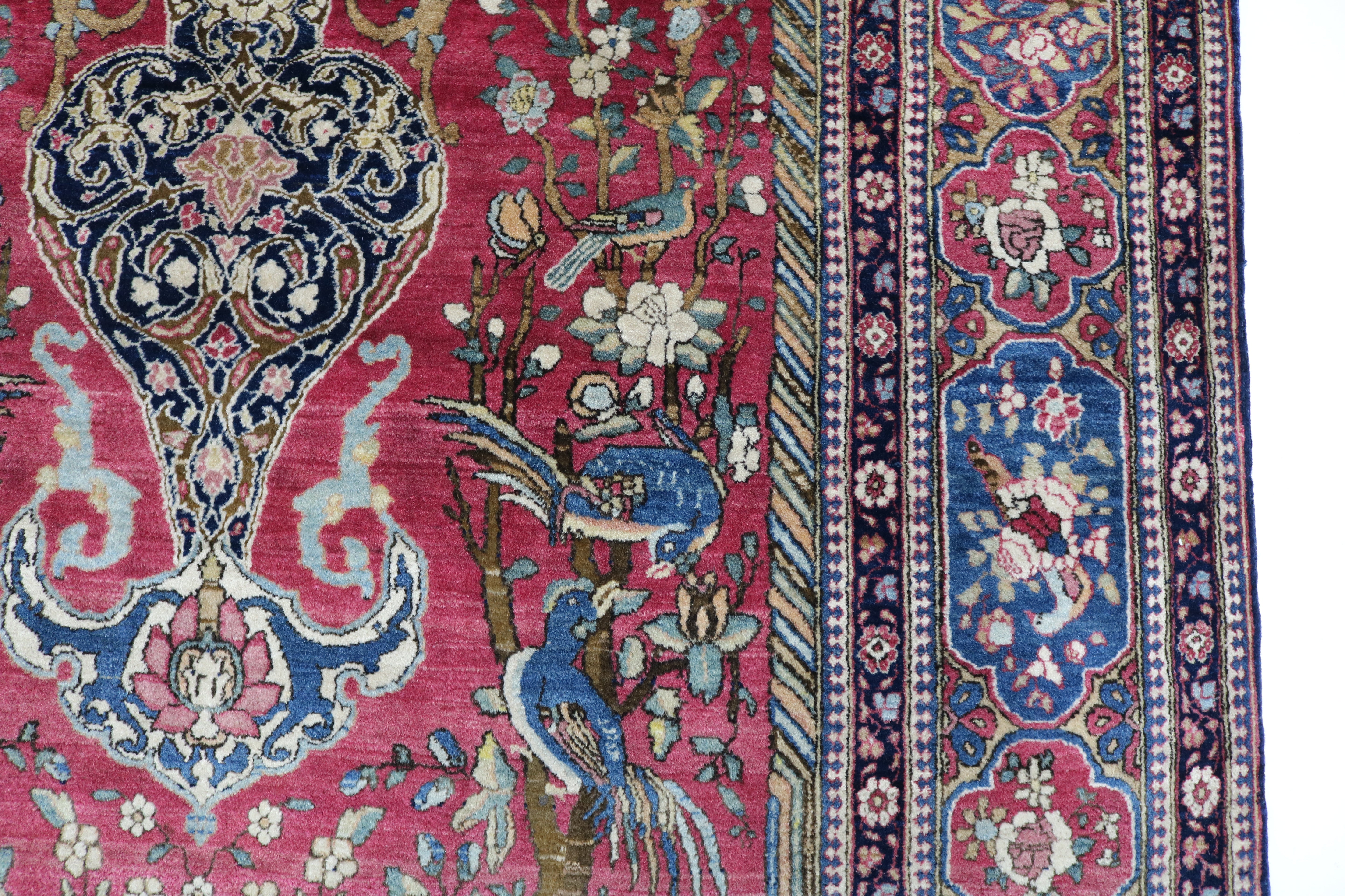 Close-up of finely knotted wool texture on antique Isfahan rug
