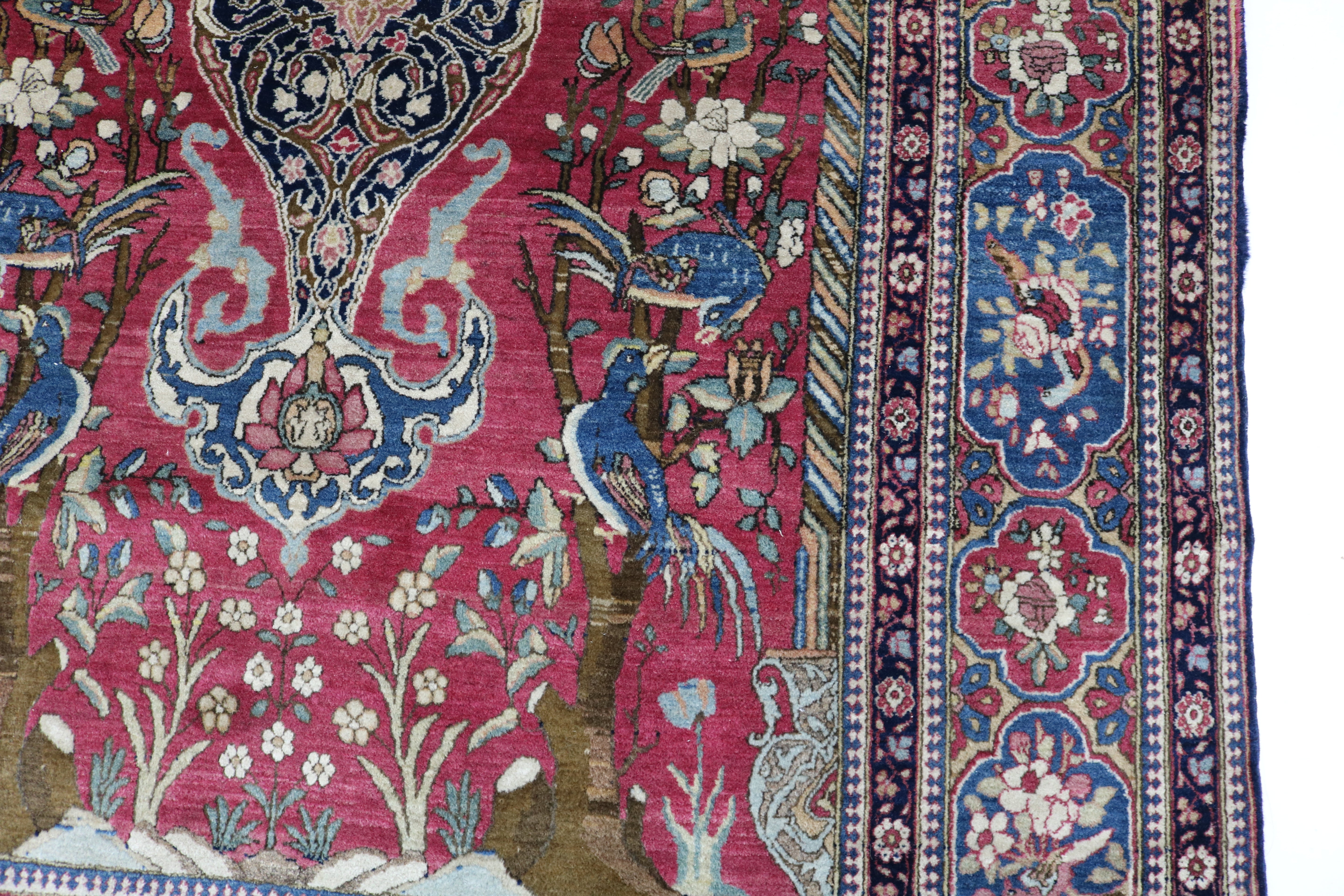 Close-up of finely knotted wool texture on antique Isfahan rug
