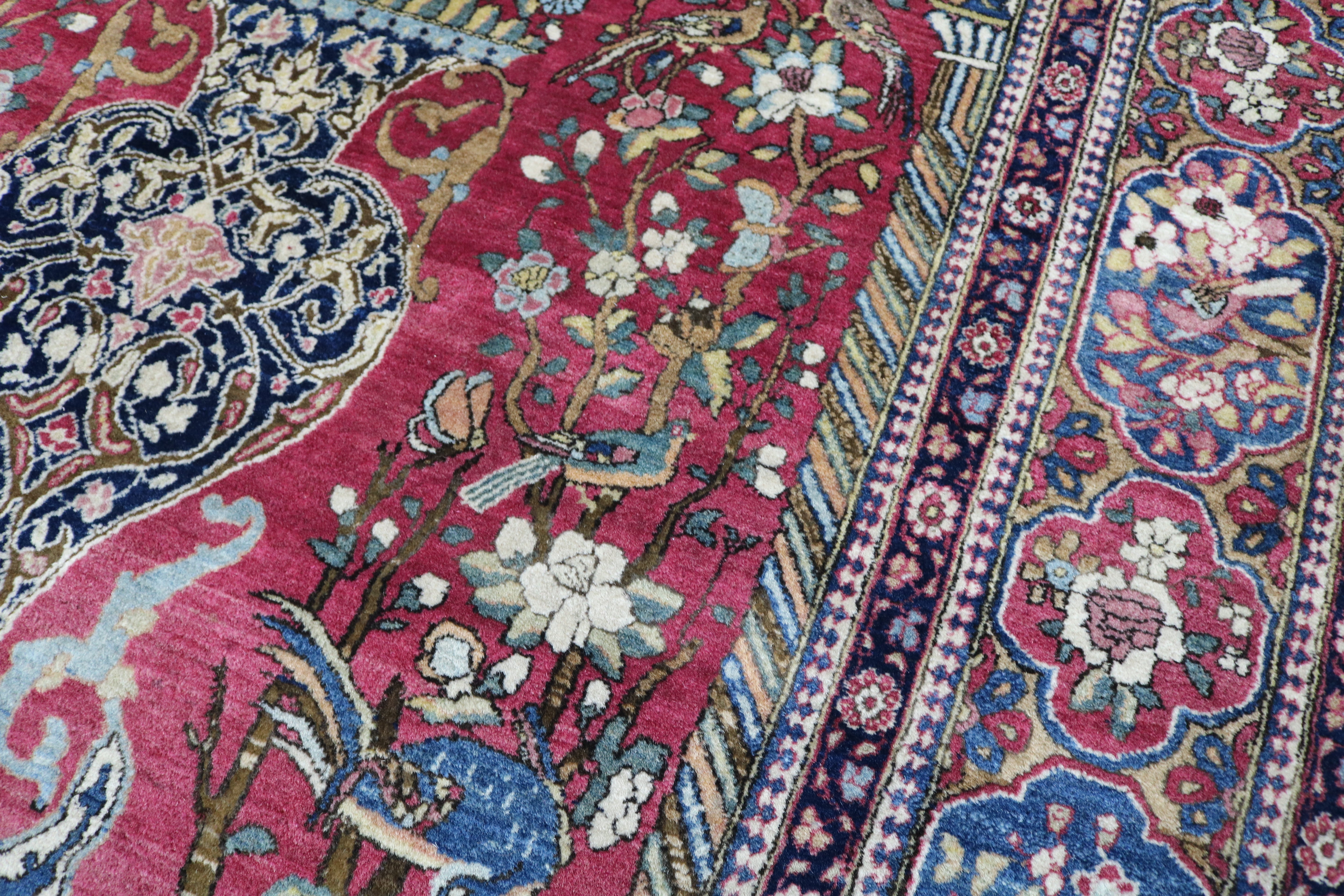 Close-up of finely knotted wool texture on antique Isfahan rug
