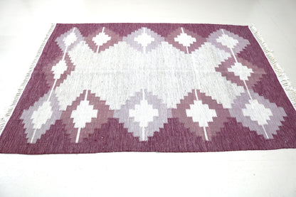 Detail of vintage Swedish Kilim rug showing handwoven wool texture and Scandinavian geometric pattern, mid-century flatweave