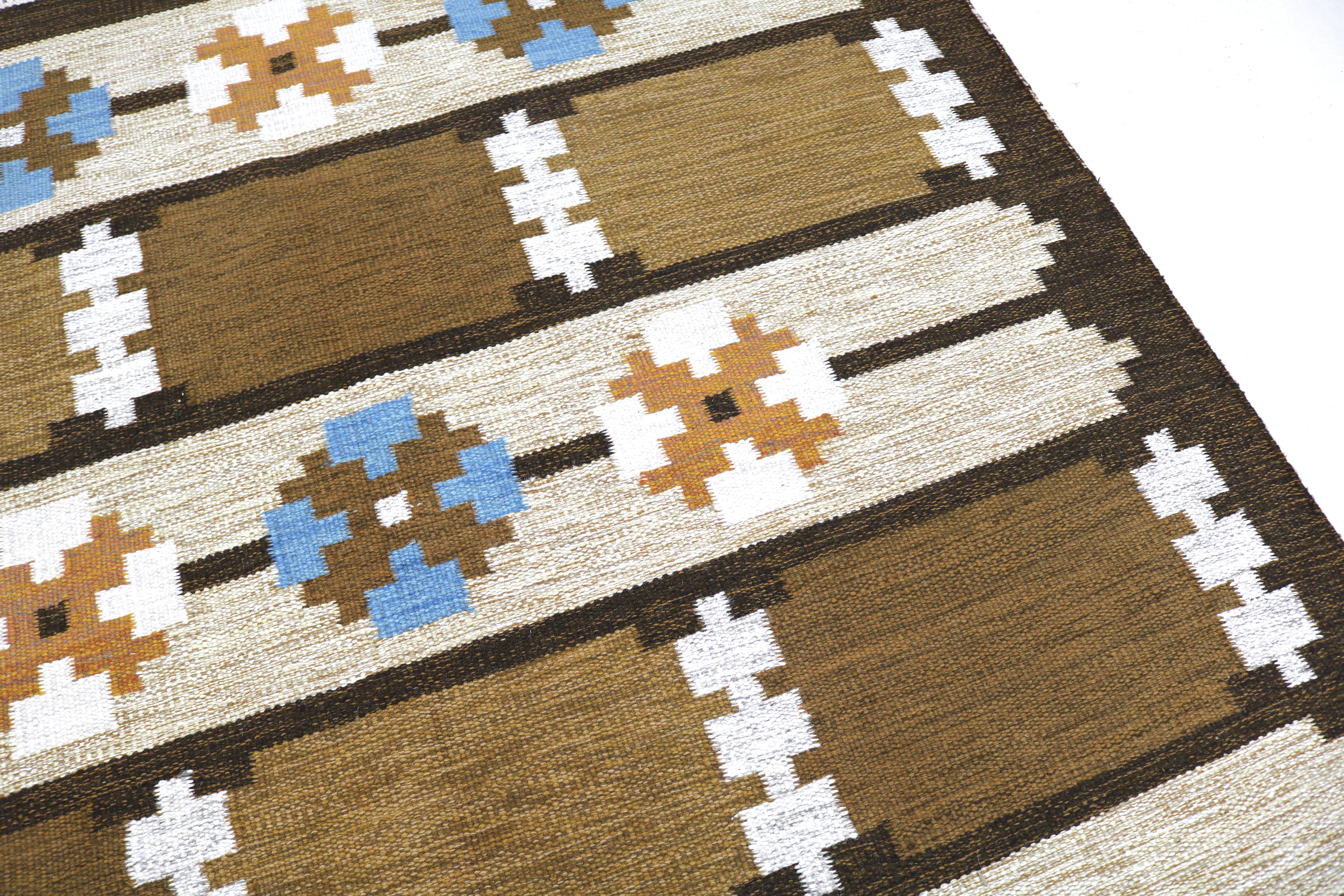Close-up texture of authentic vintage Swedish wool flatweave rug.