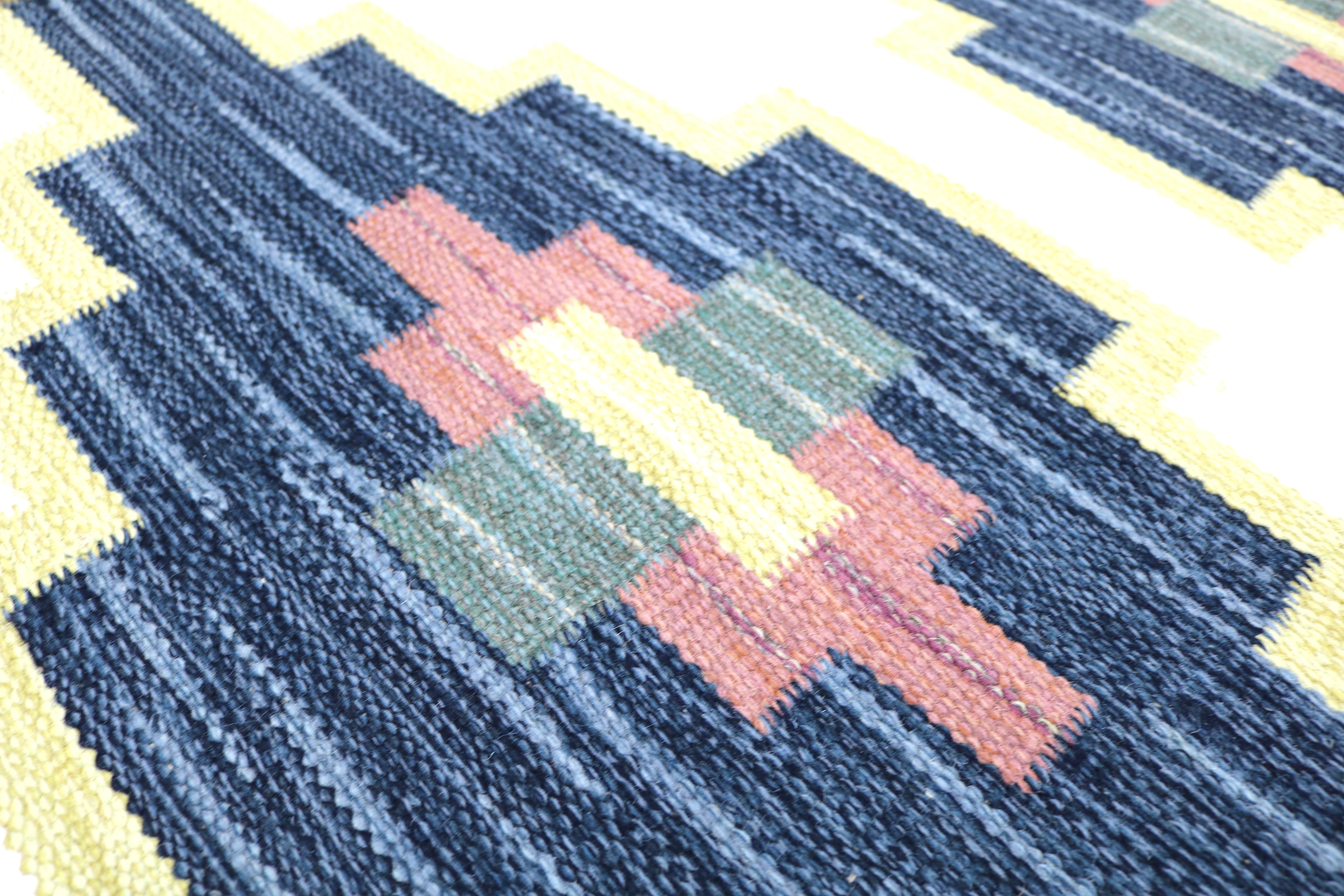 Handwoven Swedish flatweave rug with mid-century Nordic design.