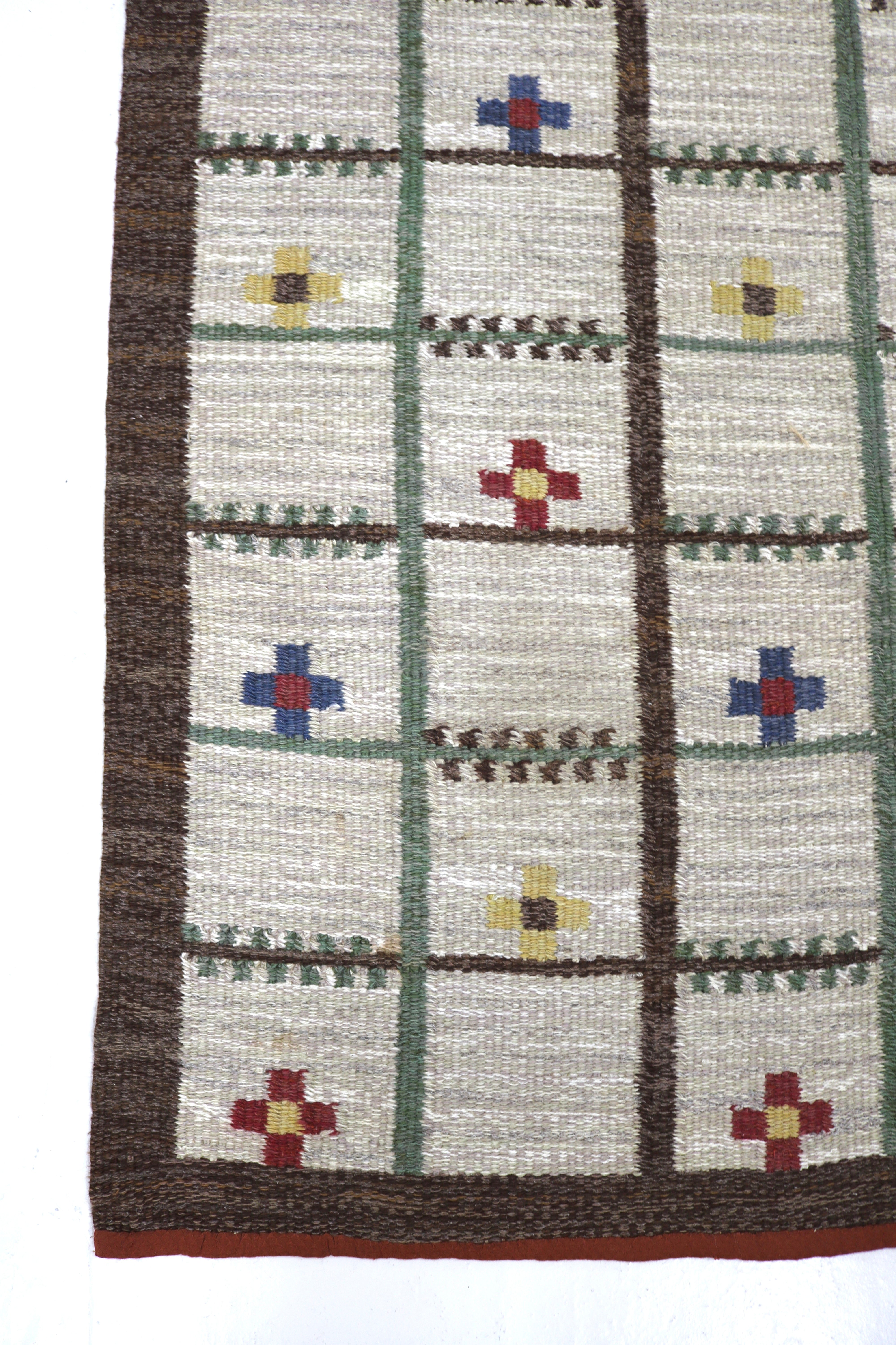 Vintage Swedish kilim rug 230 × 127 cm with lattice pattern and colourful geometric motifs.