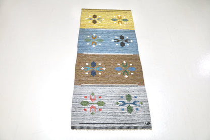 Vintage Swedish kilim rug, full view, handwoven wool with geometric motifs and muted colour palette
