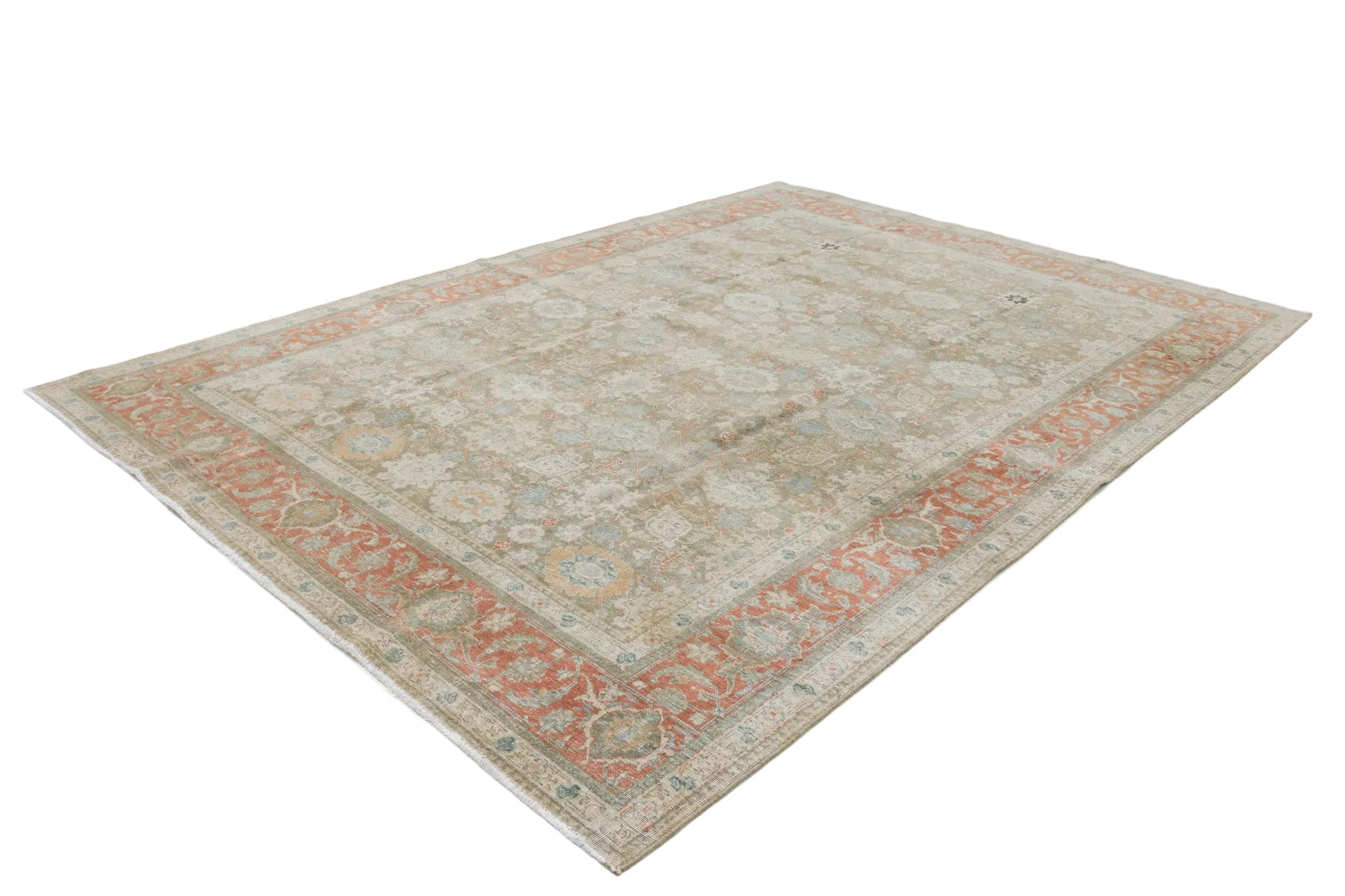 Hand-knotted antique Persian Heriz rug with bold geometric pattern and richly aged colours