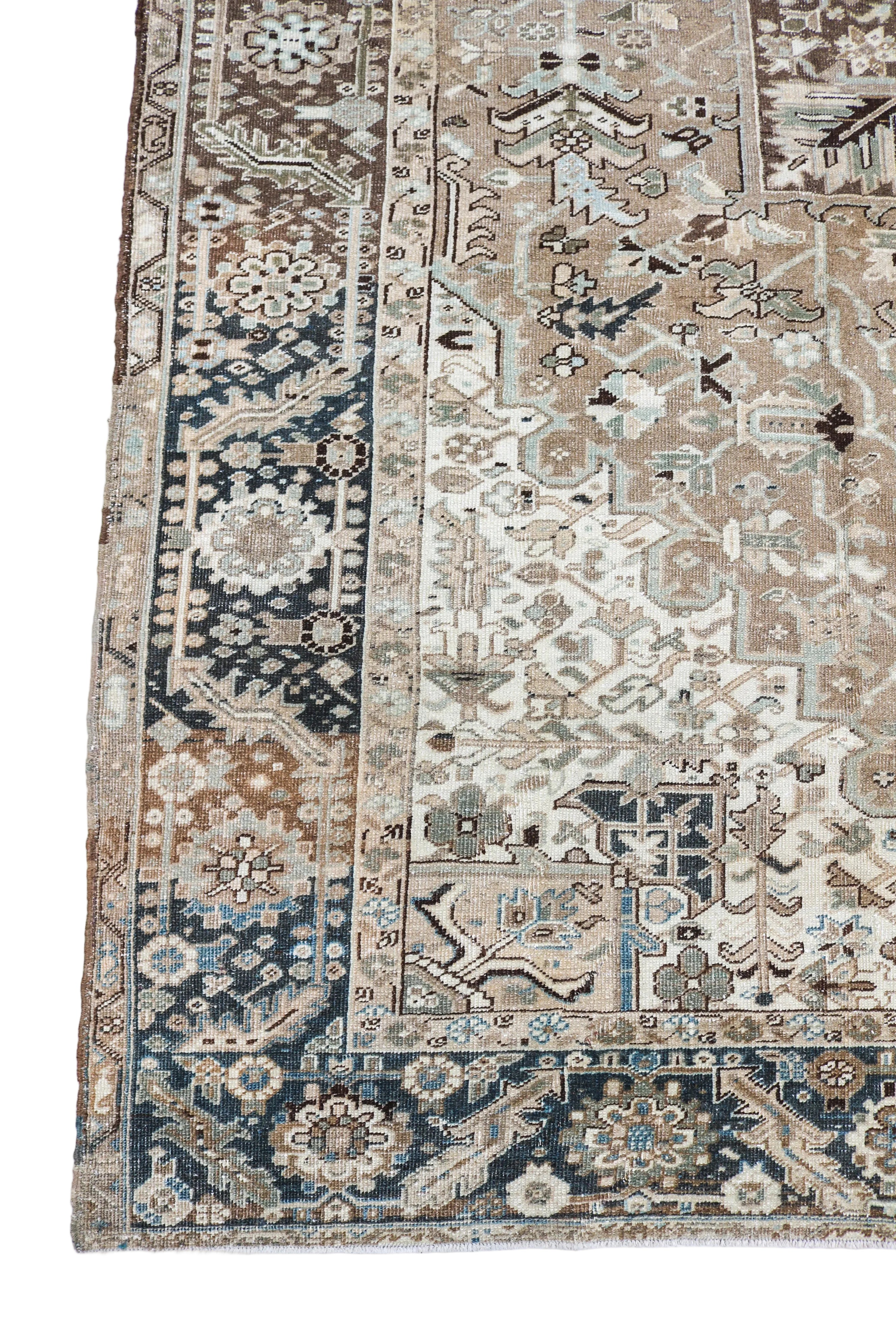 Antique Persian Heriz carpet corner detail with geometric border and naturally aged neutral tones circa 1930