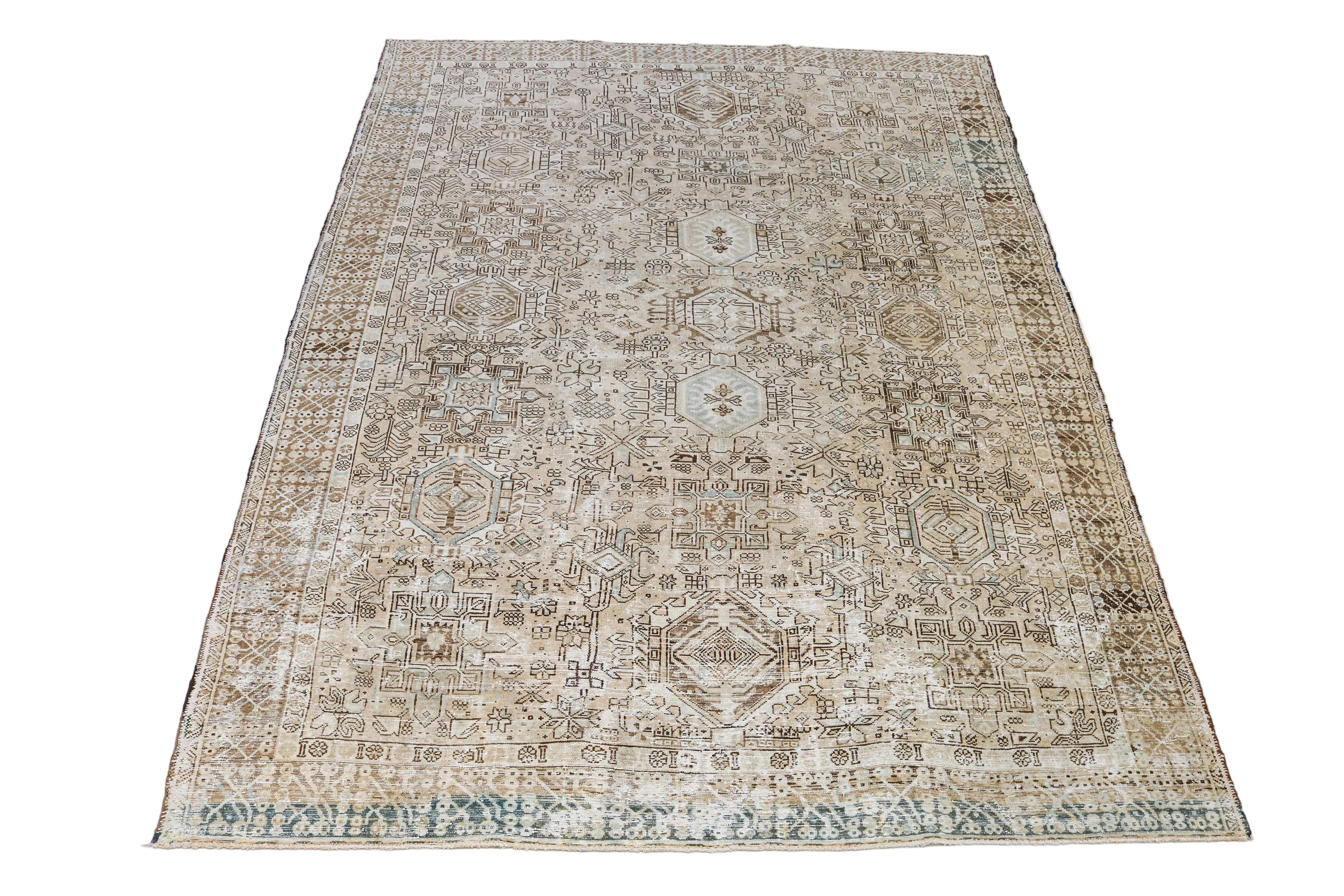 Large antique Persian Heriz-Karaja carpet with intricate geometric motifs in beige and ivory tones