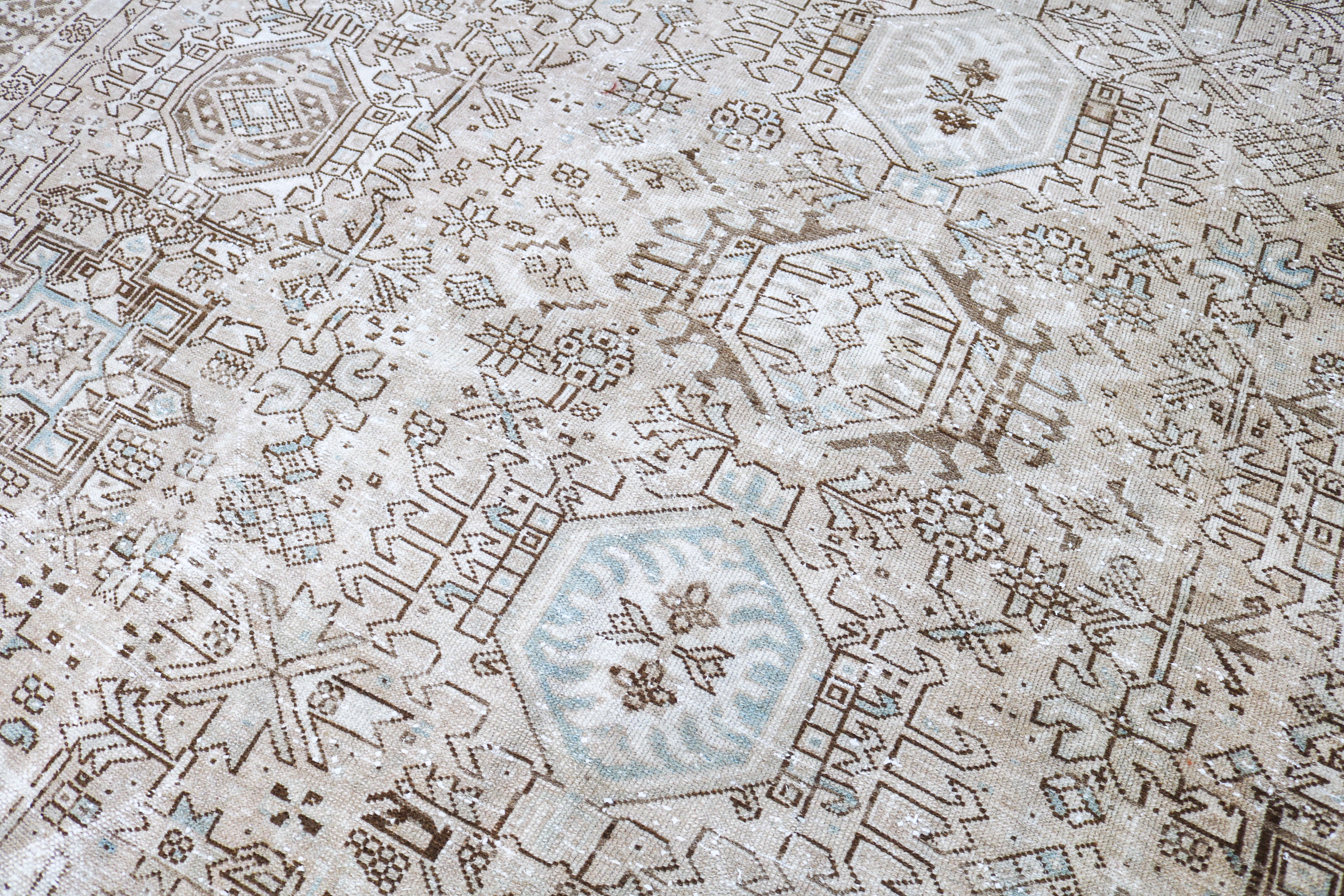 Handwoven Persian Heriz-Karaja rug detail with refined geometric drawing and authentic aged character