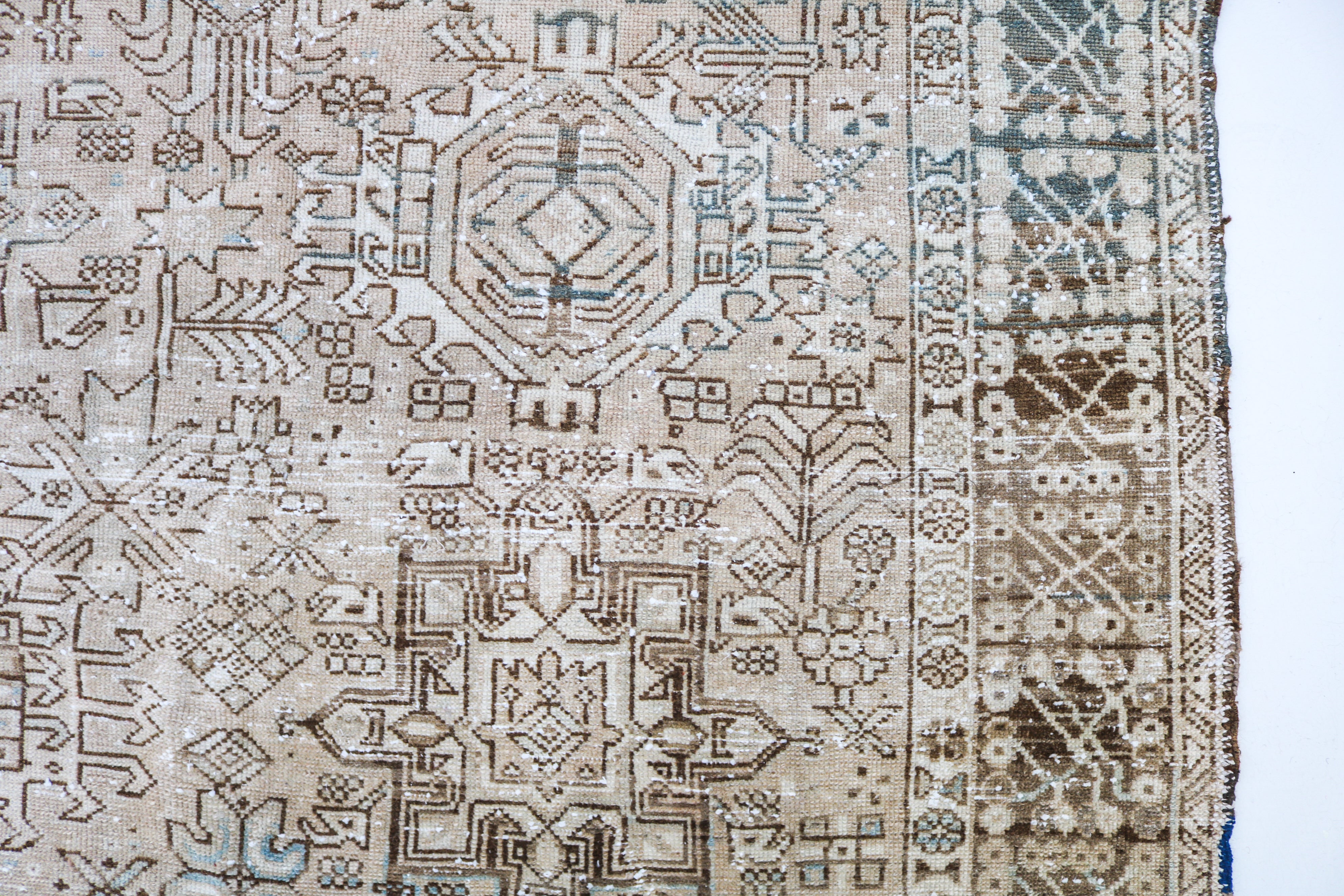 Handwoven Persian Heriz-Karaja rug detail with refined geometric drawing and authentic aged character