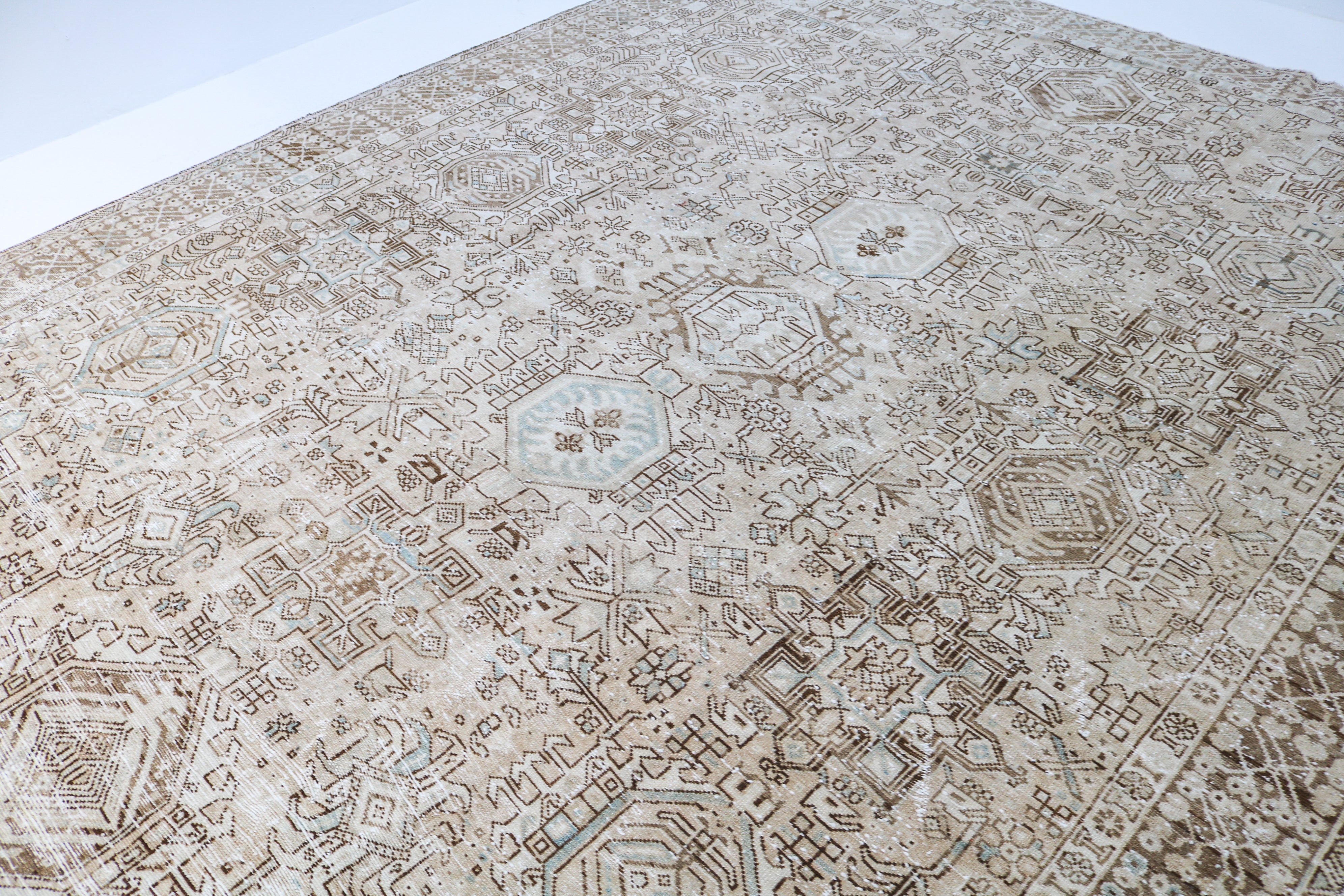 Handwoven Persian Heriz-Karaja rug detail with refined geometric drawing and authentic aged character