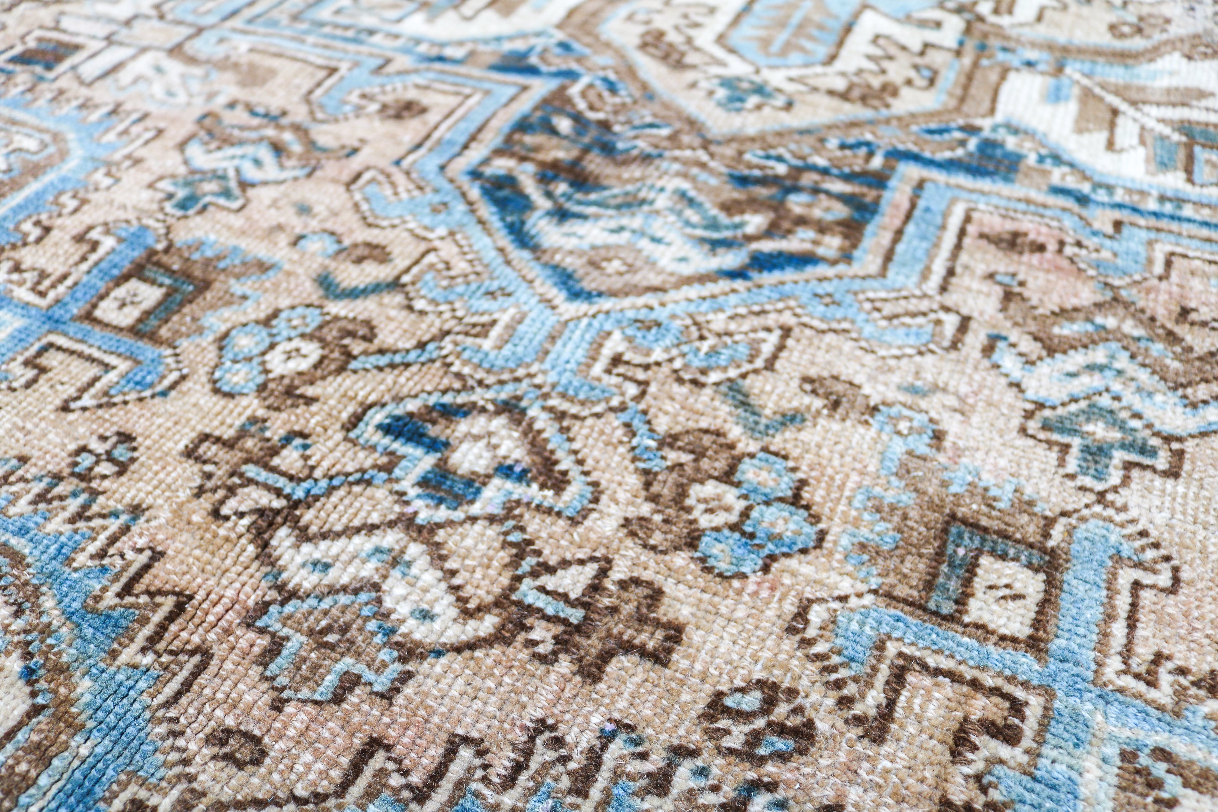 Handwoven Persian Heriz rug detail with refined tribal drawing and naturally aged character