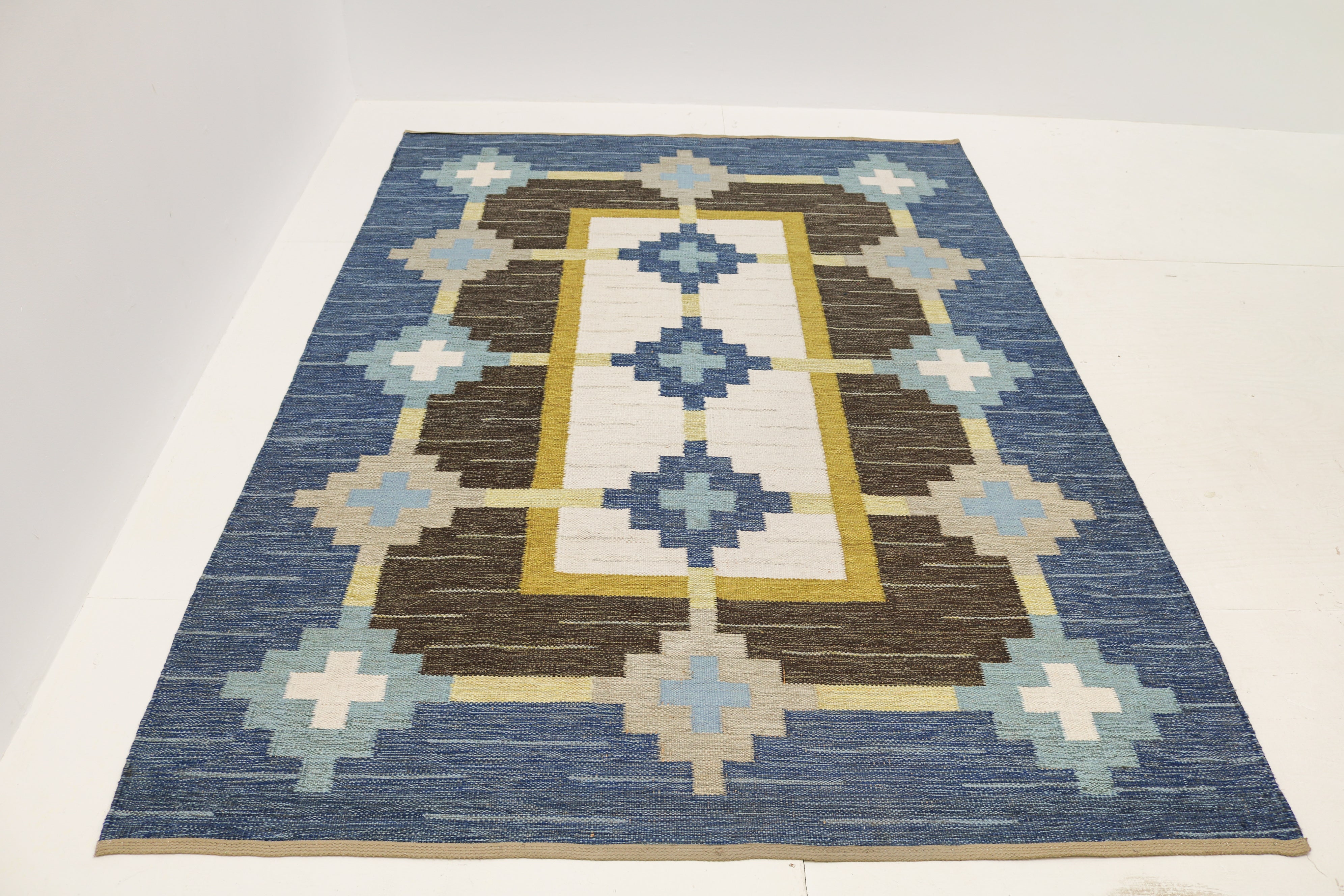Vintage Swedish kilim rug 237 × 170 cm in blue, brown, ivory and muted yellow