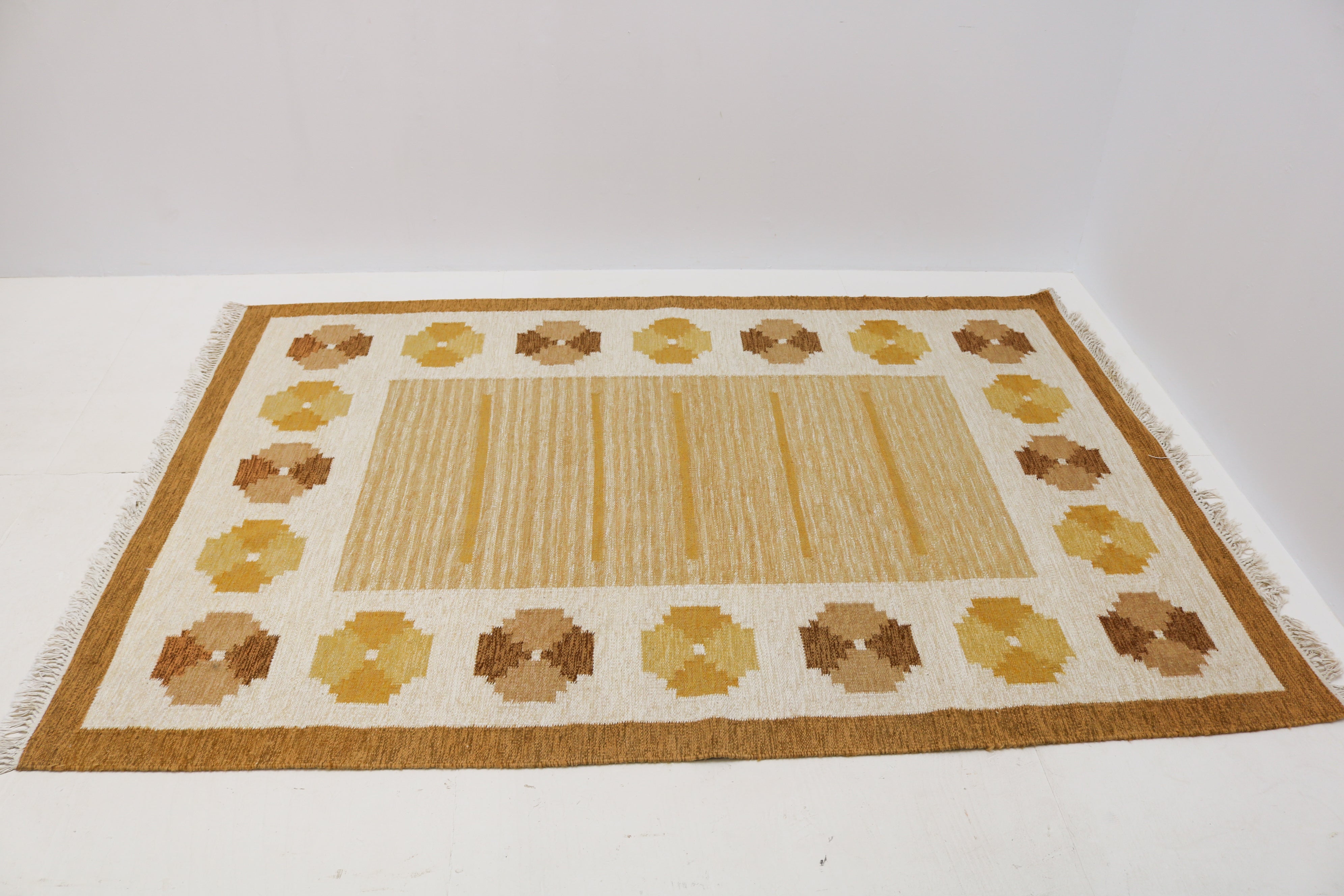 Handwoven Swedish flatweave rug with geometric floral border