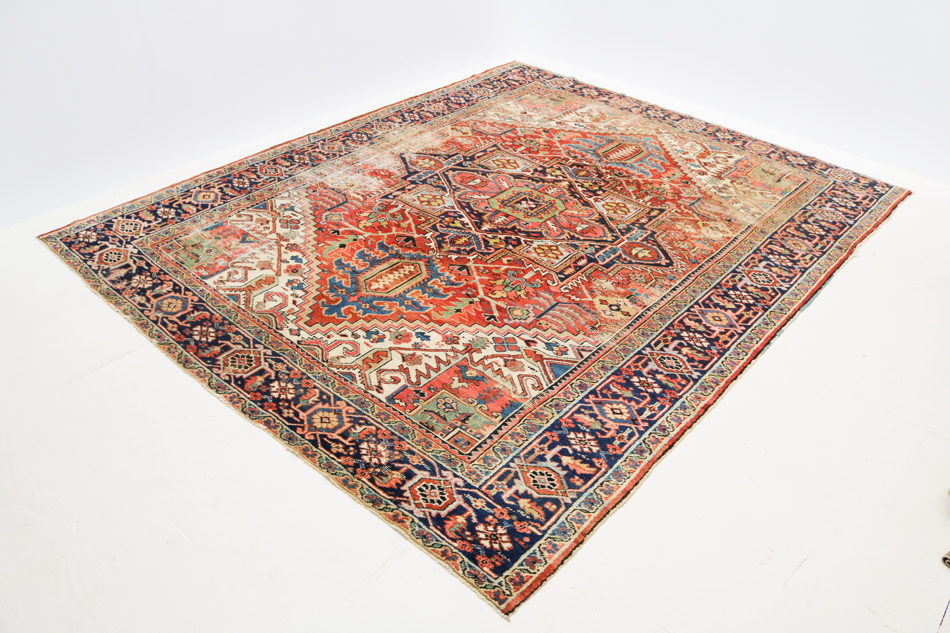 Naturally aged surface and patina of antique Persian Heriz rug dating from circa 1910