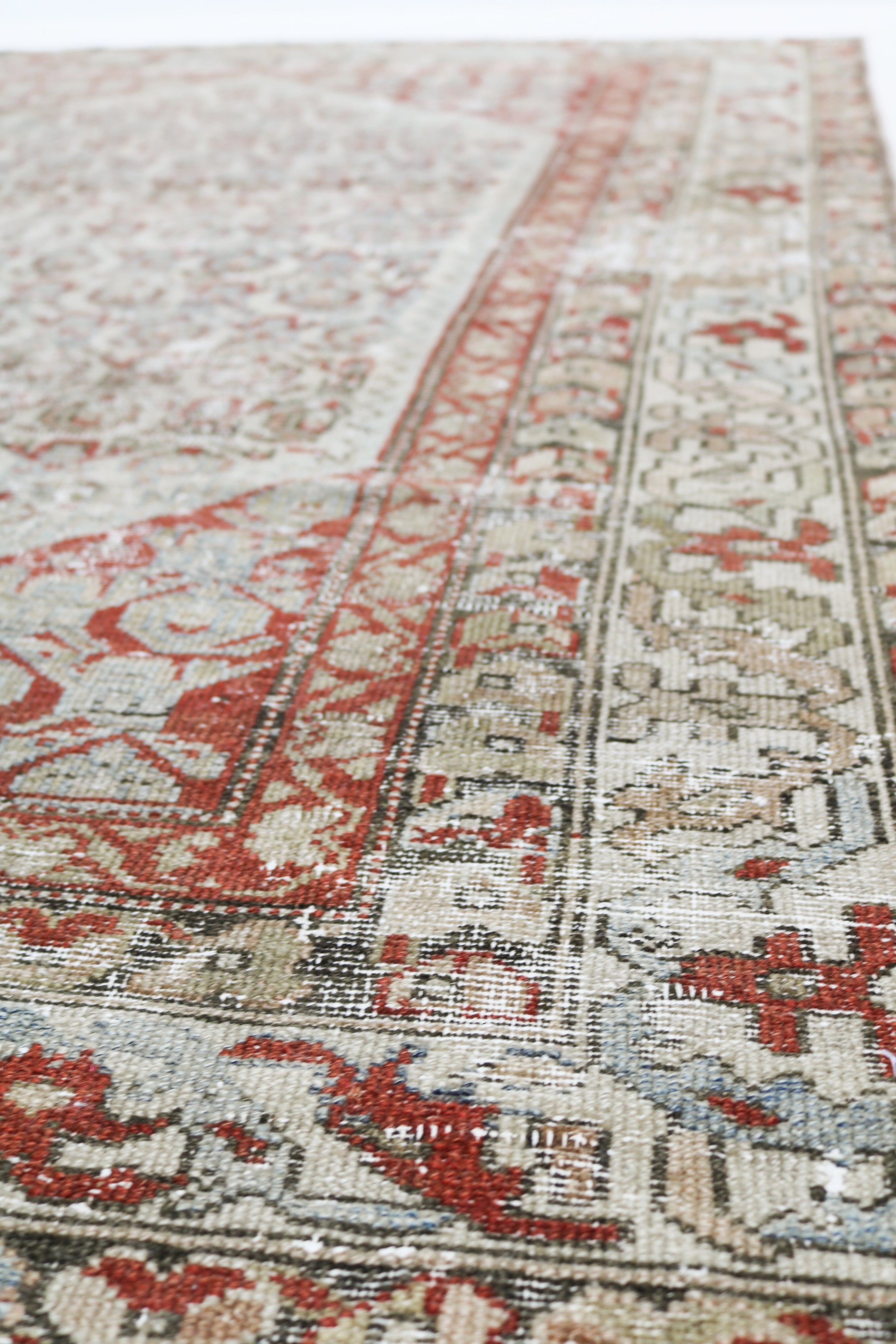 Antique Persian Malayer rug circa 1920, hand-knotted in wool with naturally worn pile and muted colours