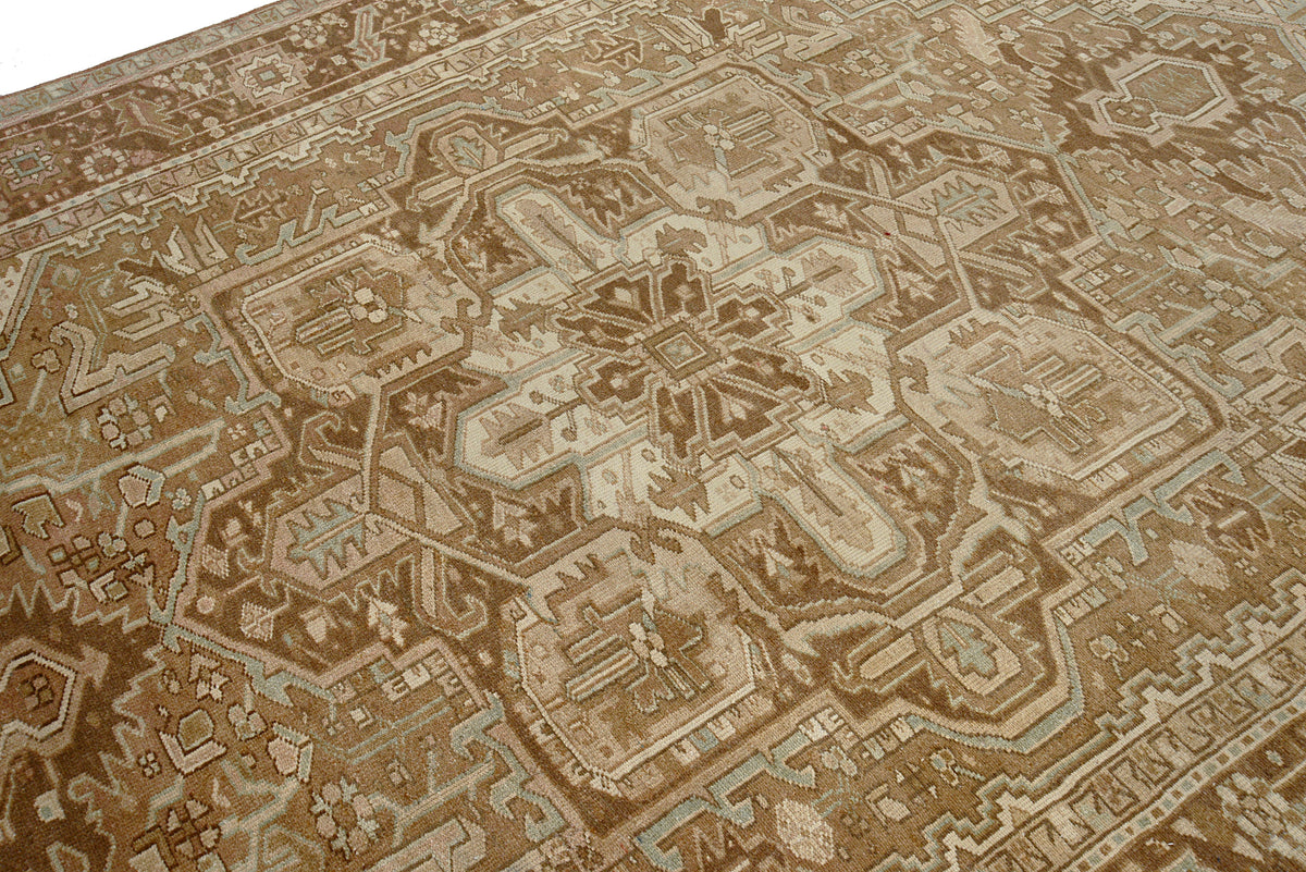 Close-up of Heriz carpet corner with intricate geometric motifs and decorative border