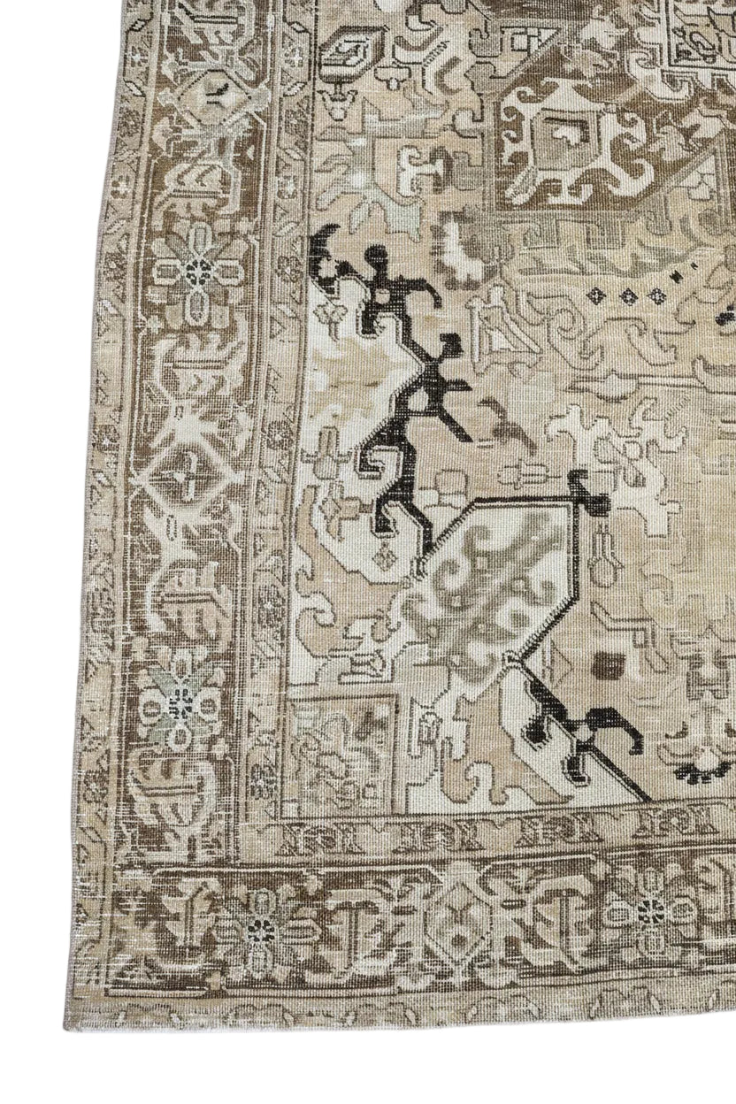Vintage Persian Heriz carpet with warm beige field and softly drawn geometric motifs