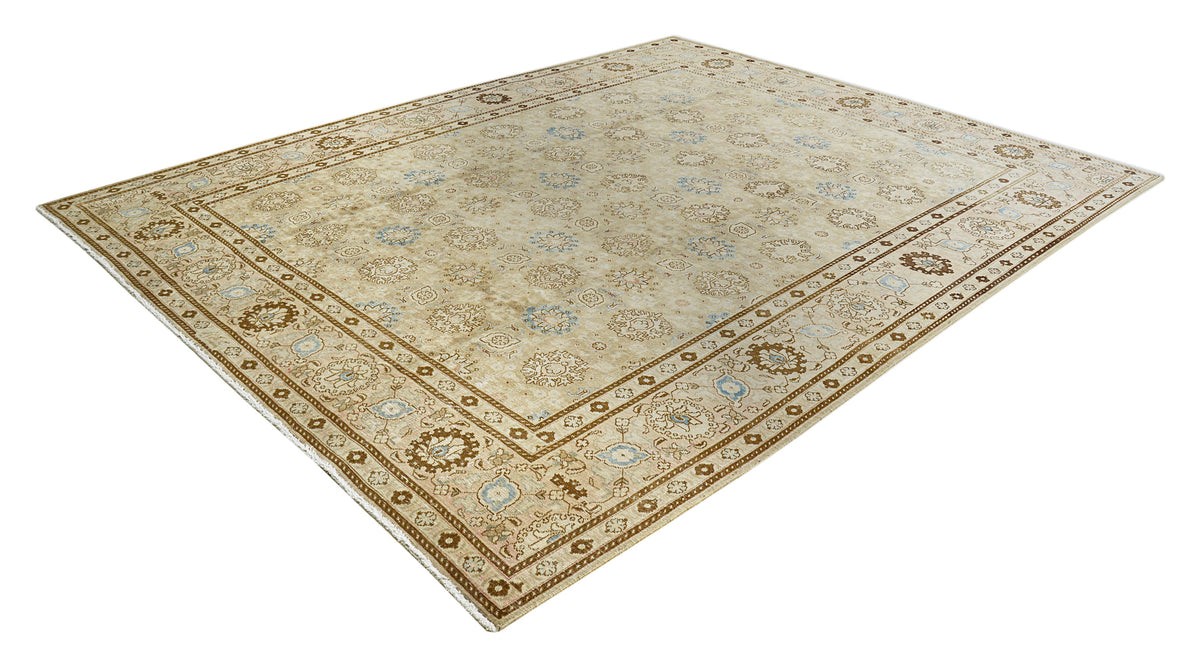 Full Persian Tabriz carpet featuring delicate floral motifs and detailed decorative borders
