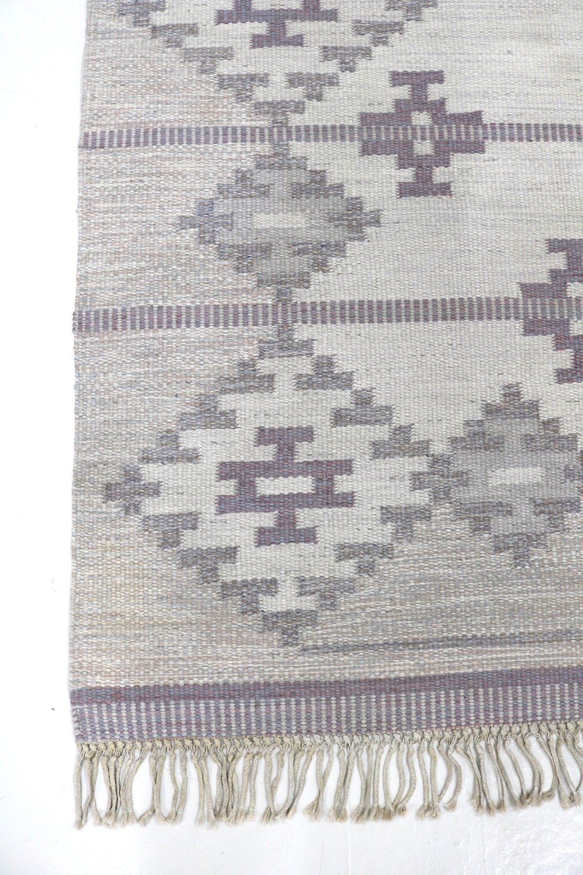 Vintage Swedish Kilim rug with muted grey field and repeating geometric diamond motifs