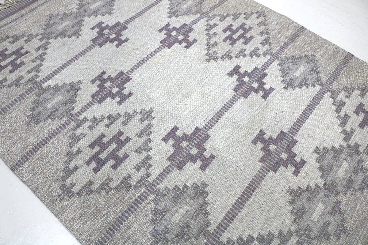 Angled detail of Swedish Kilim highlighting geometric pattern and flat-woven texture