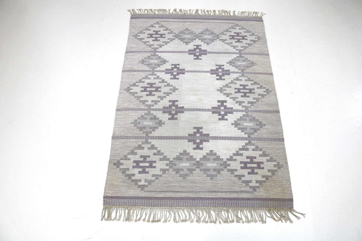 Full Swedish Kilim showing balanced geometric pattern in soft grey and cream tones