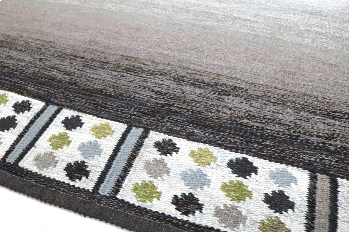 Detailed Swedish Kilim section showing soft tonal transitions and geometric border