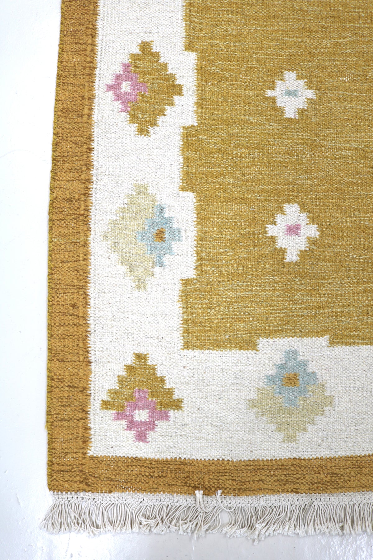 Vintage Swedish Kilim runner with golden ochre field and colourful floral motifs