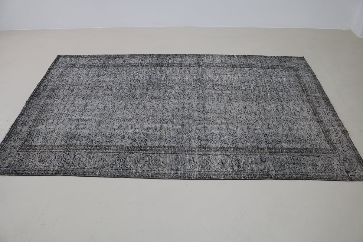 Full view of vintage Turkish Sparta rug with understated floral design and neutral tones
