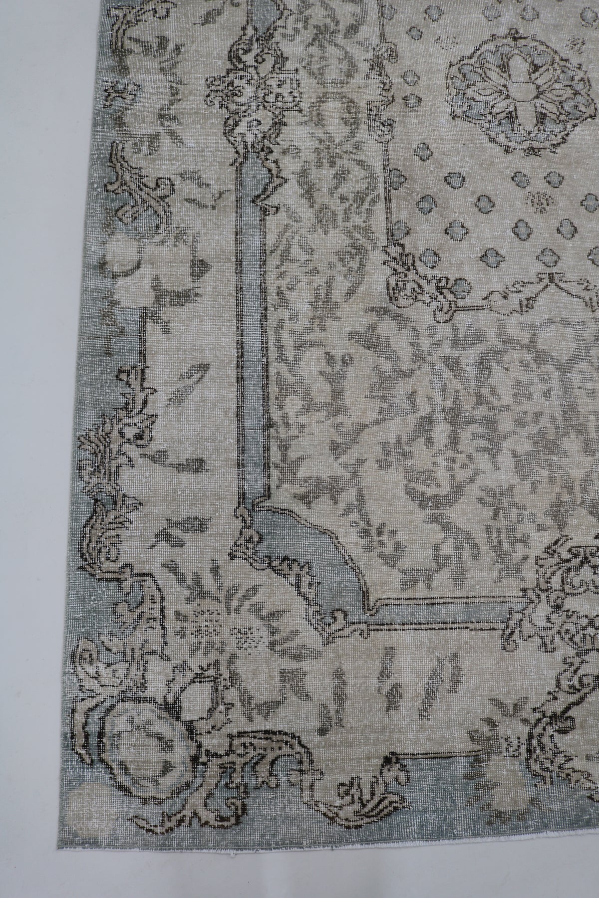 Vintage Turkish Sparta rug with soft grey field, delicate floral motifs and ornate border
