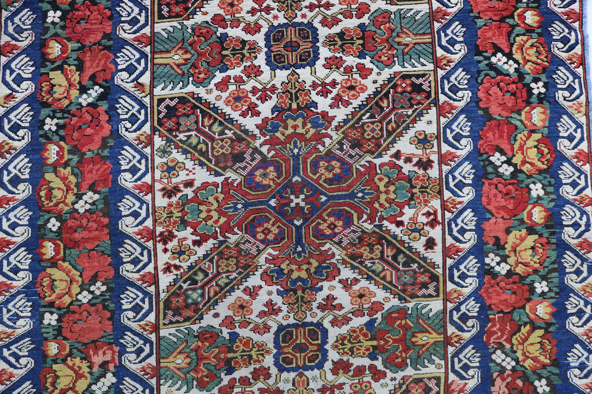 Detailed view of Zeichur runner showing central geometric motifs and floral borders