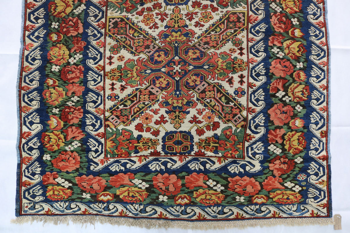 Close-up of the lower section showing dense floral motifs and patterned border