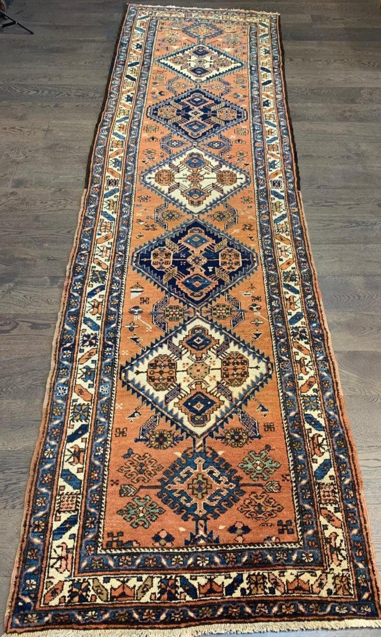 Antique Heriz Karaja runner with walnut-brown field and bold geometric medallions