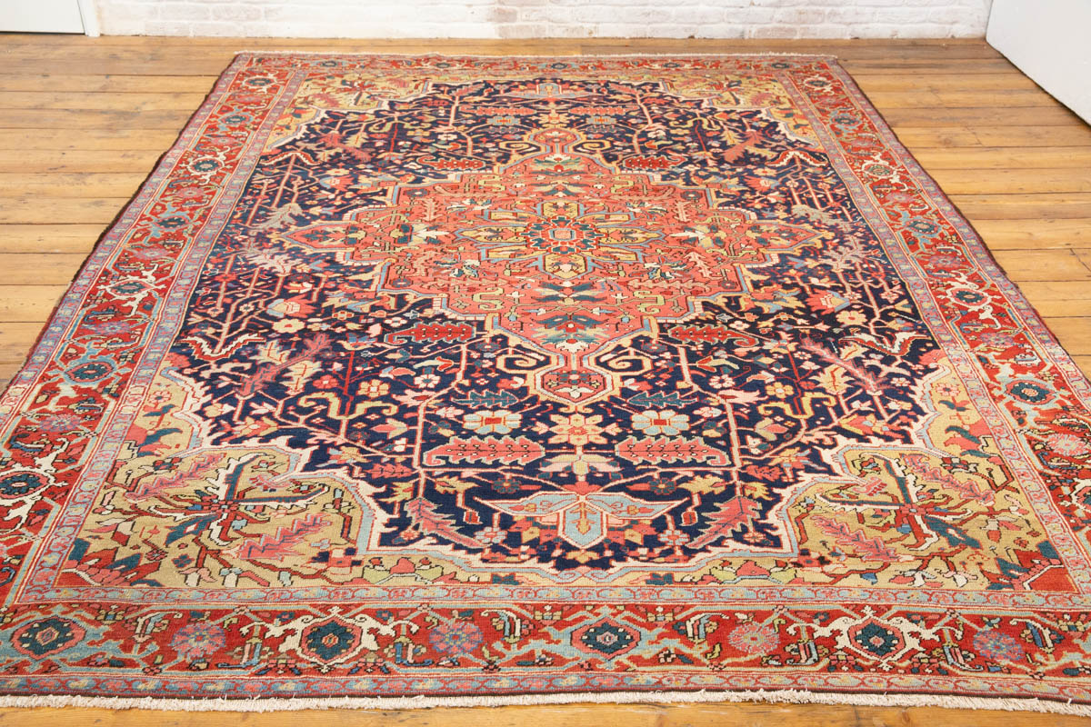 Full Heriz Serapi carpet showing balanced composition and richly patterned borders