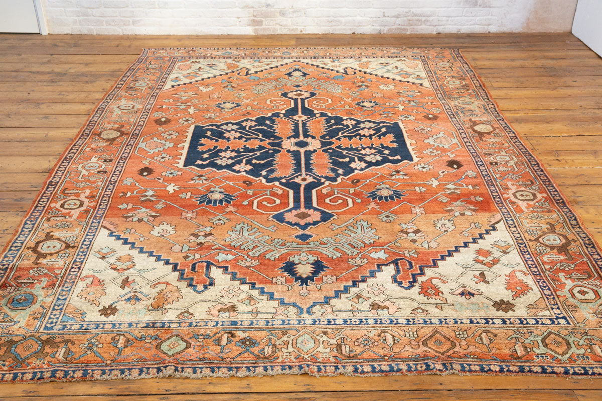 Full Heriz Serapi carpet showing balanced medallion design and rich earth tones