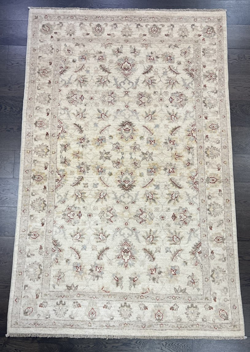 Full Afghan Ziegler rug showing balanced floral design across a light ivory field