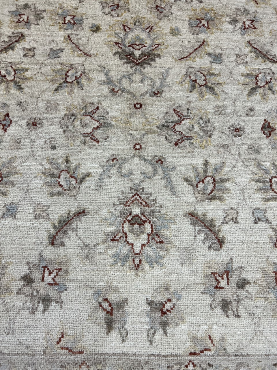 Detailed Ziegler rug section featuring scattered floral motifs across the light field