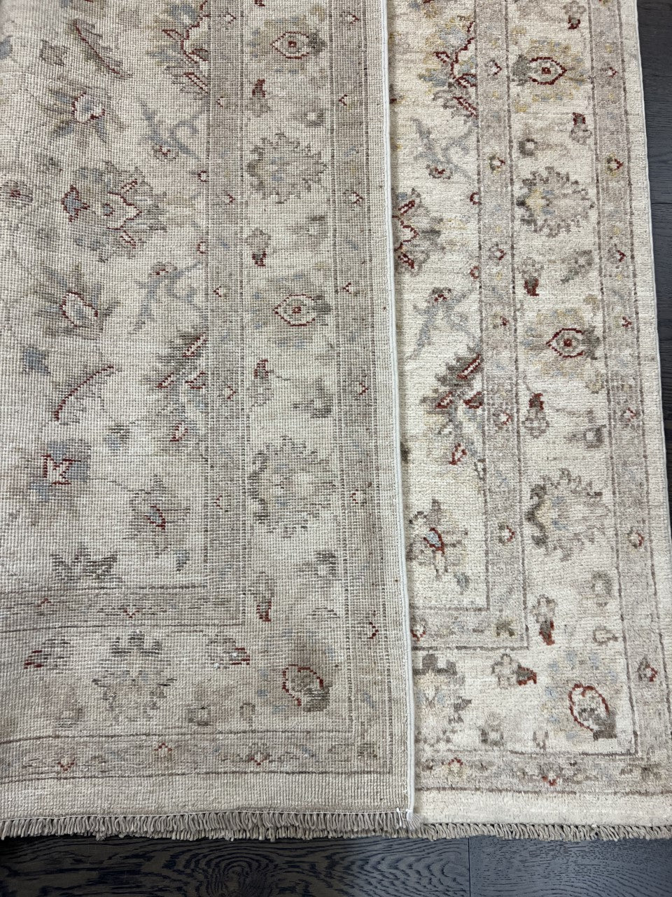 Close-up showing intricate floral patterns and layered decorative border details