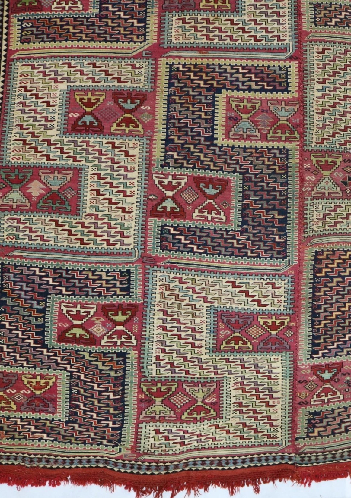 Vintage Caucasian Zilleh rug with bold geometric blocks in red, cream and blue