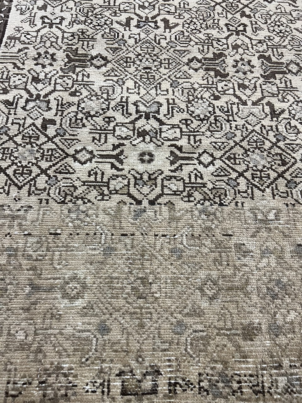 Close-up of intricate Malayer motifs with geometric and floral detailing