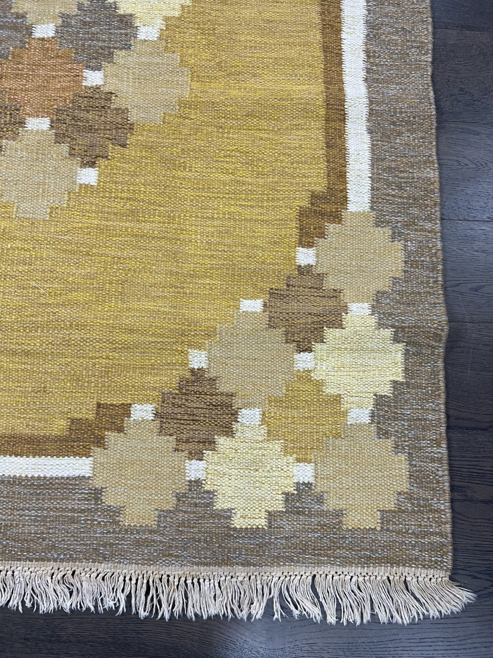 Detailed Kilim section with geometric diamond shapes arranged along the border